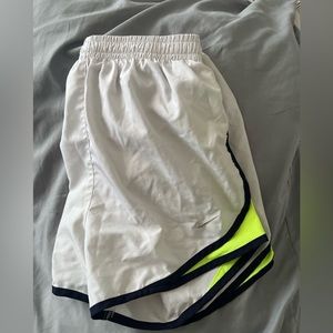 White with bright yellow trim. Nike shorts